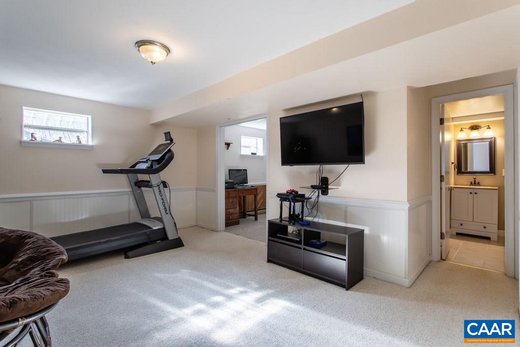 2938 Milton Road Charlottesville, VA 22902 - Photo 18 of 44 a room with gym equipment and a flat screen tv