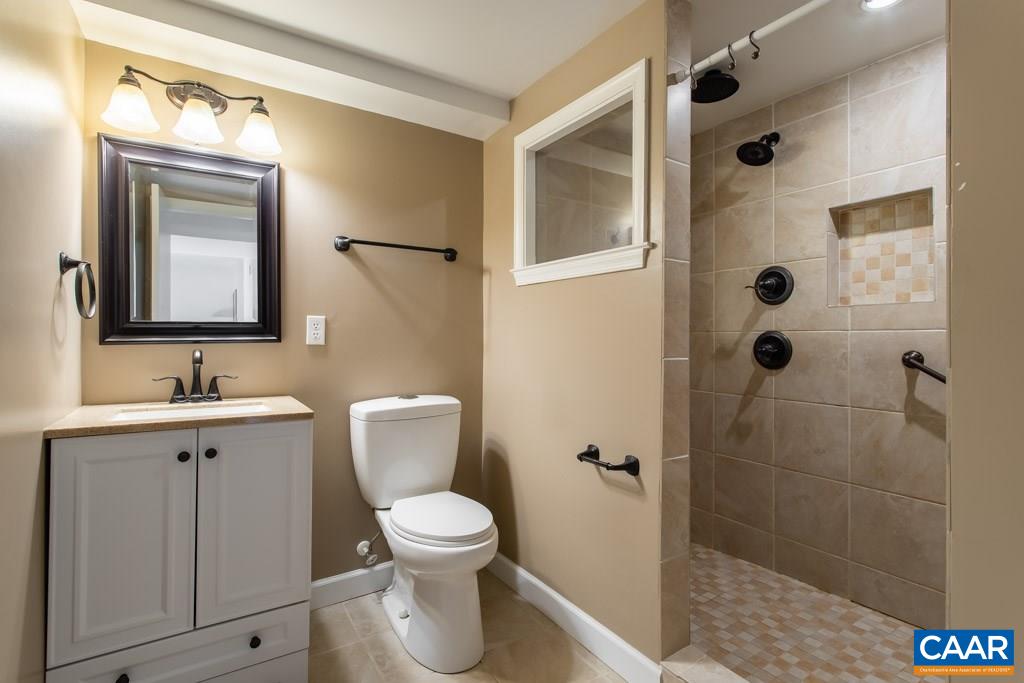 2938 Milton Road Charlottesville, VA 22902 - Photo 20 of 44 a bathroom with a toilet sink and shower