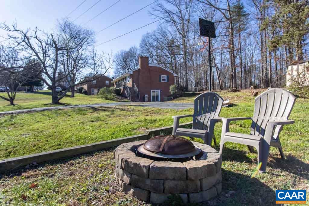 2938 Milton Road Charlottesville, VA 22902 - Photo 23 of 44 a view of a chair and table in backyard
