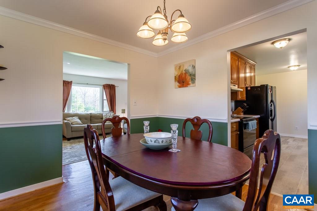 2938 Milton Road Charlottesville, VA 22902 - Photo 6 of 44 a view of a dining room with furniture window and wooden floor