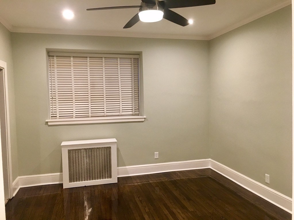 1834 Beacon Street, Unit 3 Brookline, MA 02445 - Photo 5 of 7 a view of a room with wooden floor and a window