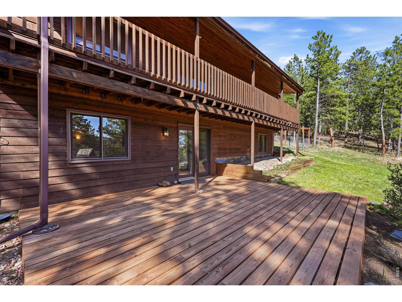 560 Quillan Gulch Road Loveland, CO 80537 - Photo 2 of 49 Front Entry enters into Lower Level finished walk out basement. New front deck!
