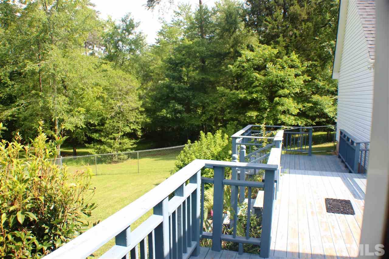 4112 Mebane Oaks Road Mebane, NC 27302 - Photo 6 of 22 Large deck connects garage to house. Plenty of space to entertain. Large fenced yard for pets.