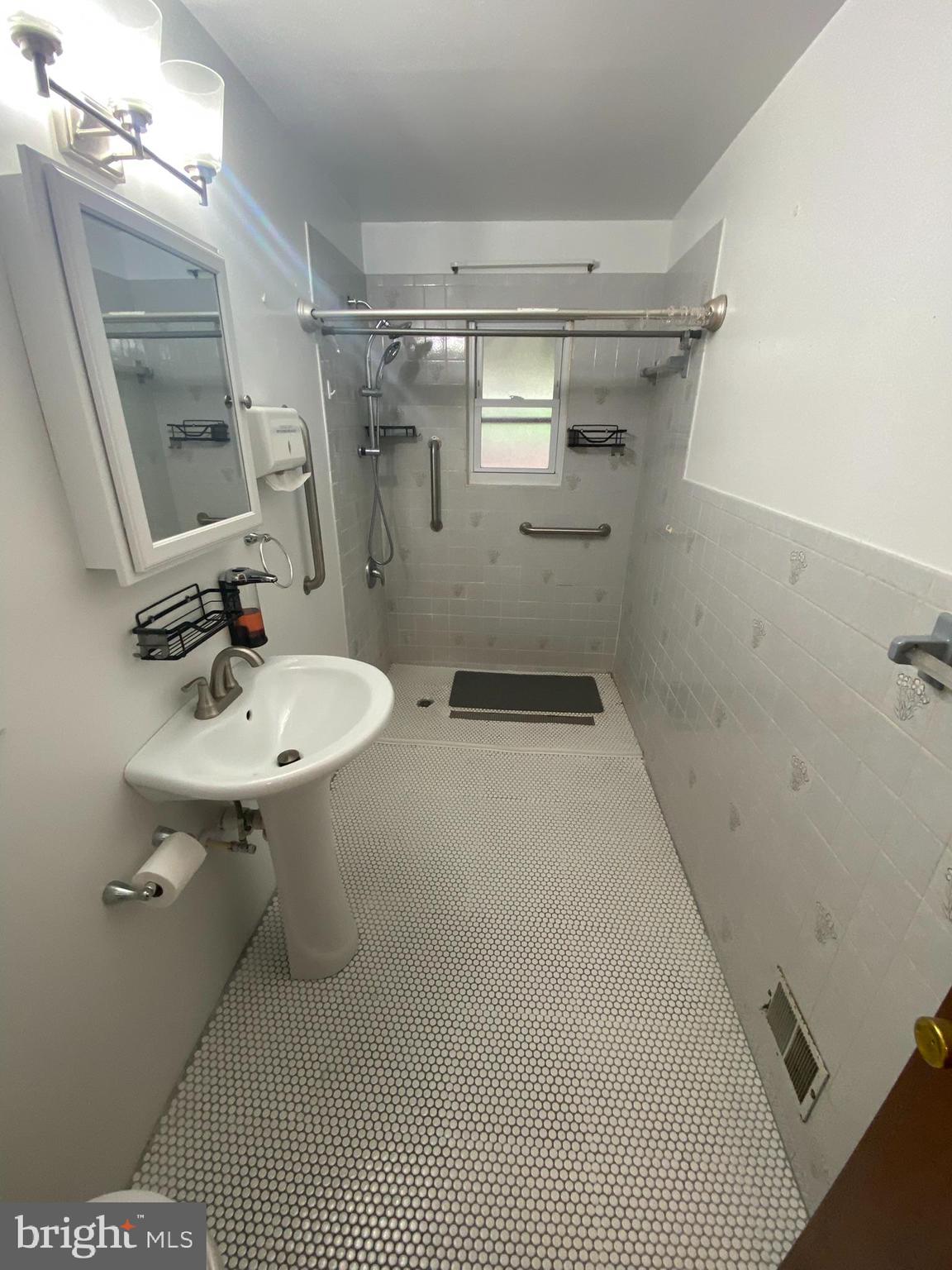 1907 Monumental Road Baltimore, MD 21227 - Photo 12 of 37 a bathroom with a sink toilet and shower