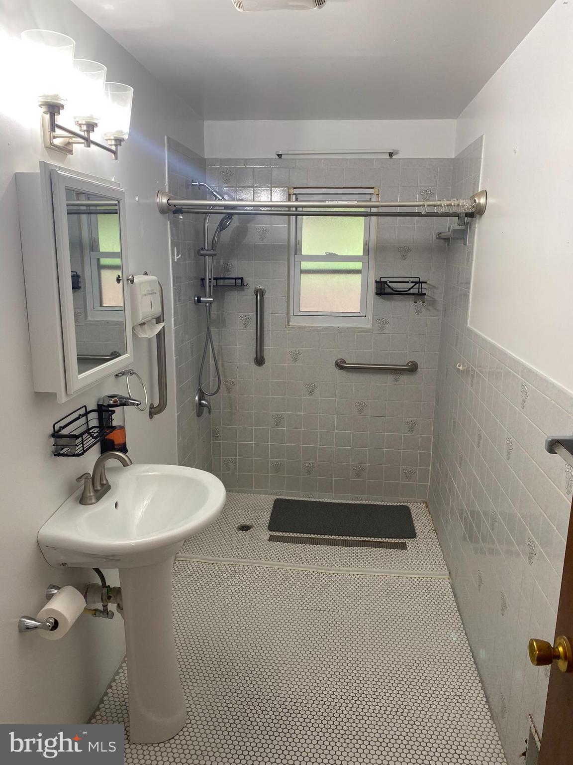 1907 Monumental Road Baltimore, MD 21227 - Photo 13 of 37 a bathroom with a sink toilet and shower