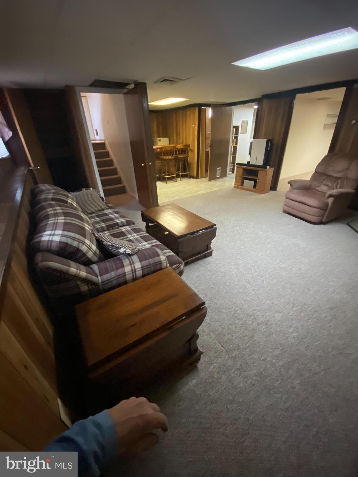 1907 Monumental Road Baltimore, MD 21227 - Photo 20 of 37 a bed room with furniture and a flat screen tv