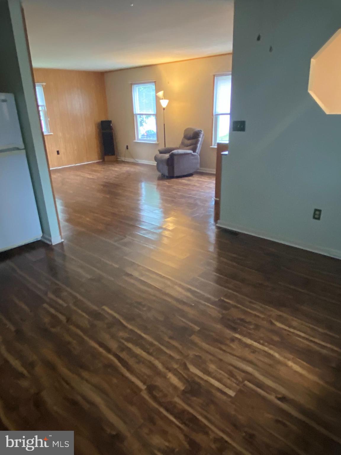 1907 Monumental Road Baltimore, MD 21227 - Photo 5 of 37 a view of empty room with wooden floor