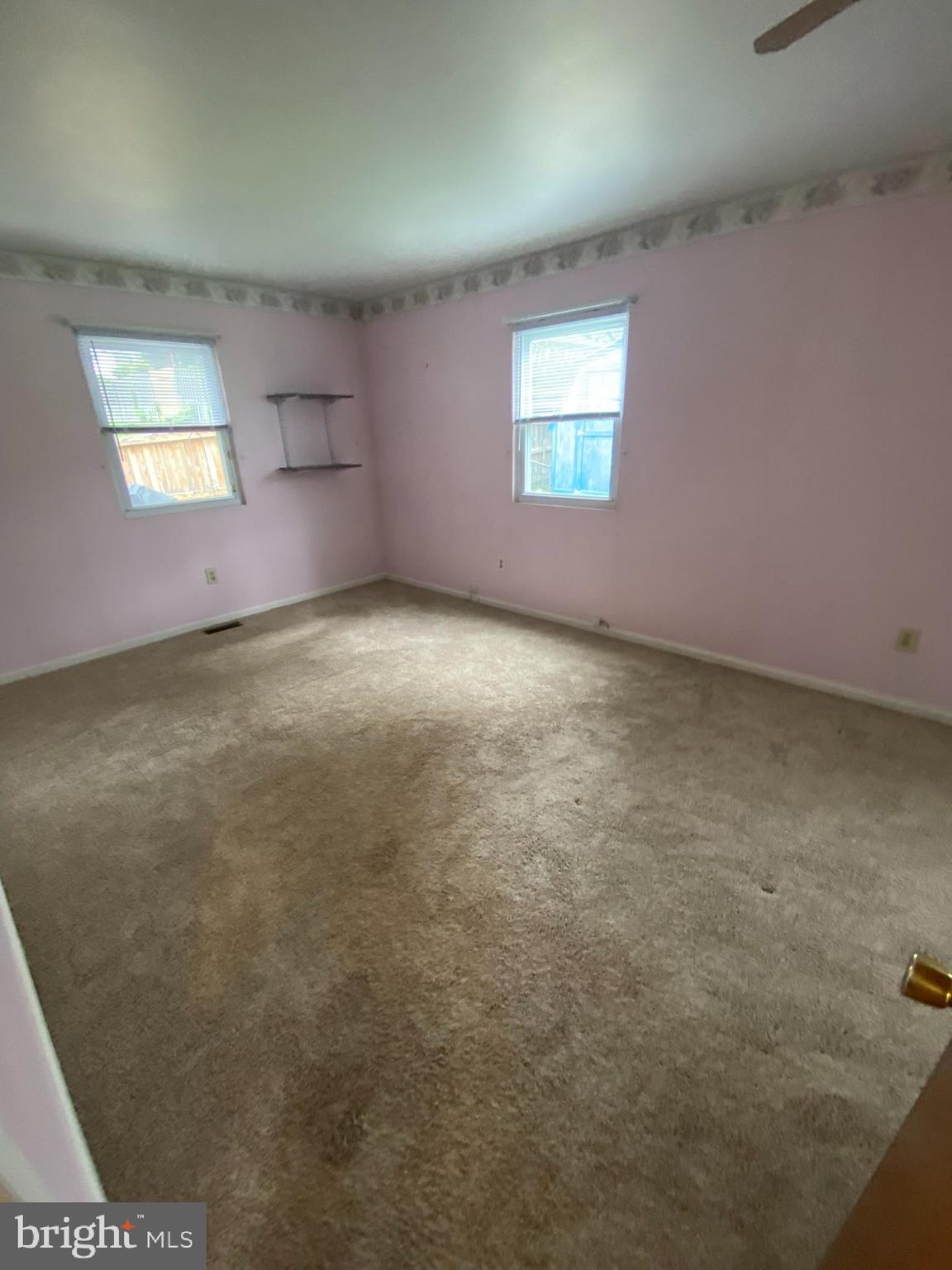 1907 Monumental Road Baltimore, MD 21227 - Photo 9 of 37 an empty room with windows