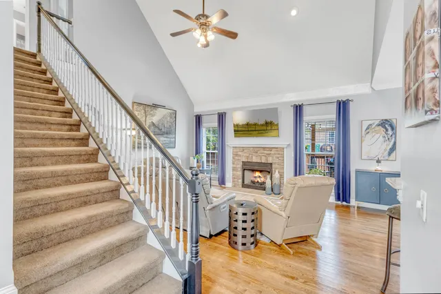 a view of a dining room with furniture wooden floor and chandelier