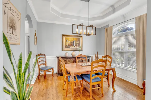 a kitchen with stainless steel appliances a refrigerator sink and cabinets