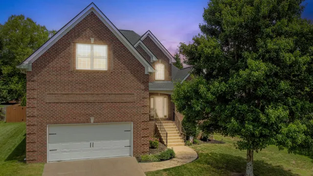 a front view of a house with a yard