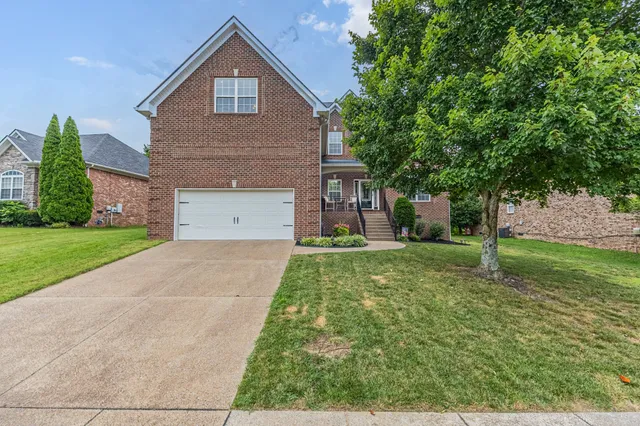 a house view with a garden space