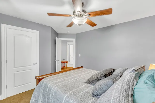 a view of a chairs and table in patio with wooden floor