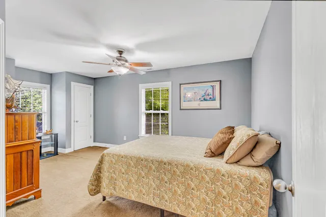 a view of a chairs and table in the back yard of the house