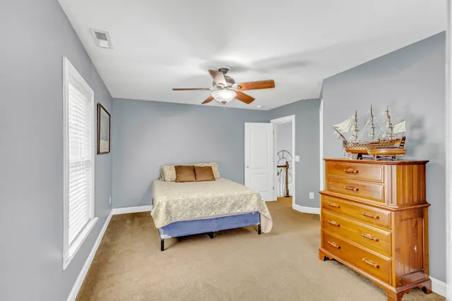 a view of backyard with a table and chairs