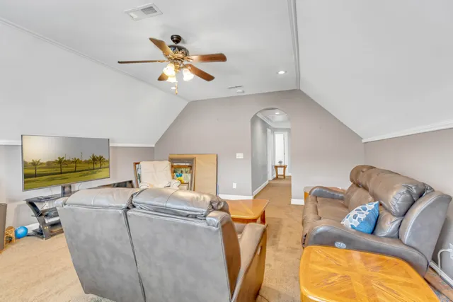 an aerial view of residential houses with outdoor space and street view