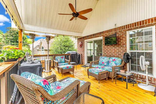 an aerial view of a house with swimming pool and garden