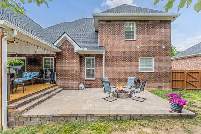 an aerial view of residential house with outdoor space and swimming pool