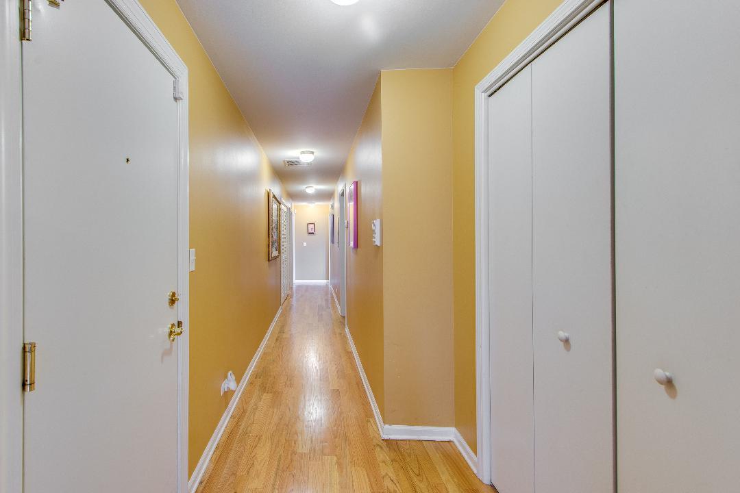 4740 South Ingleside Avenue, Unit 2N Chicago, IL 60615 - Photo 9 of 12 a view of a hallway with wooden floor