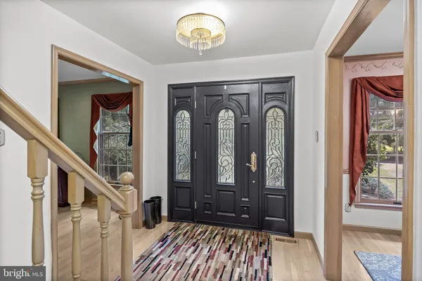 a kitchen with stainless steel appliances granite countertop a refrigerator a stove and a sink