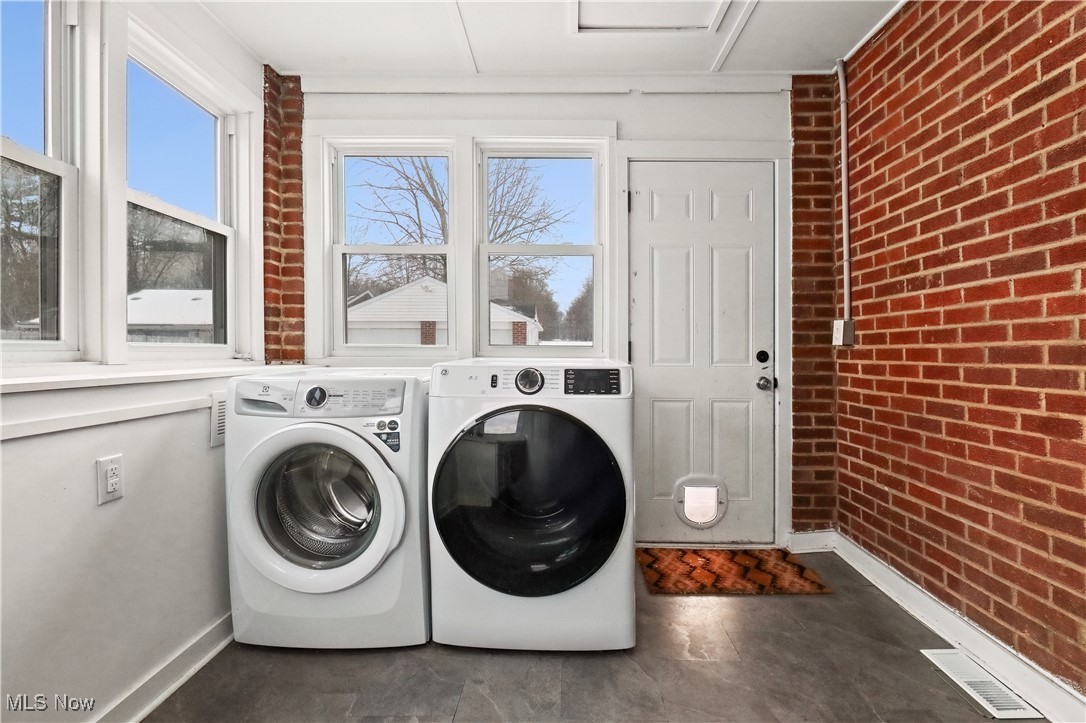 34549 Detroit Road Avon, OH 44011 - Photo 20 of 50 Laundry area with brick wall and backyard access