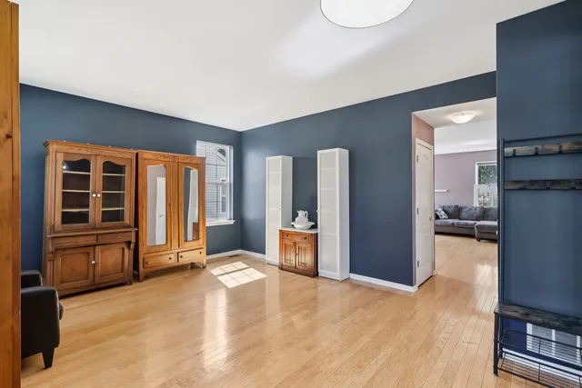 a view of a livingroom with furniture and an empty room