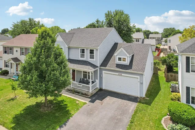 a aerial view of a house with a yard