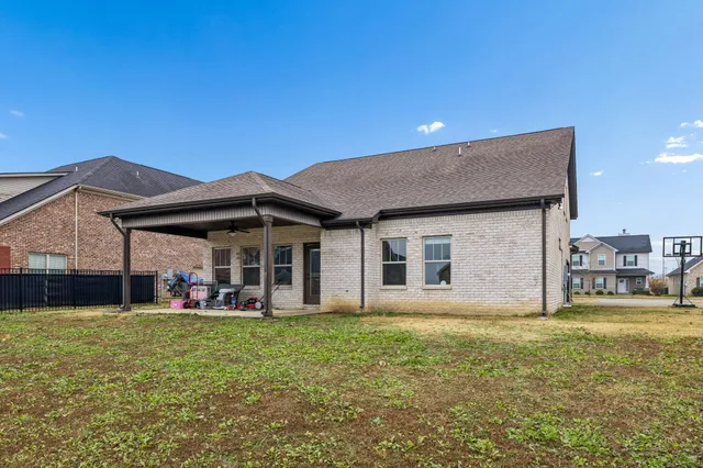 a view of a house with a yard porch and sitting area