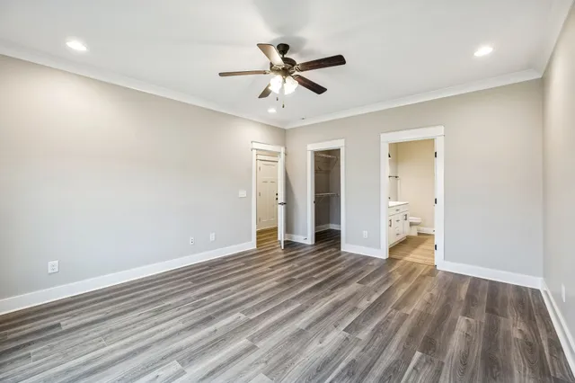 a bathroom with a double vanity sink a mirror and shower