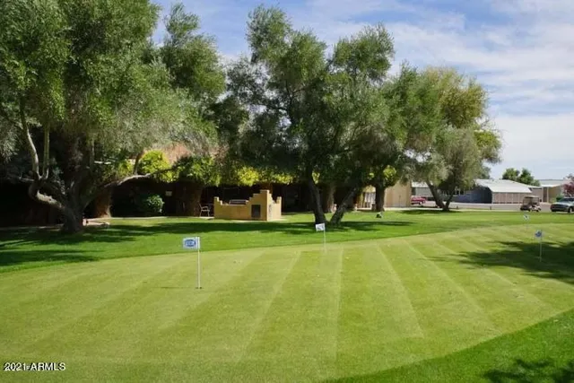 a view of a playground with basketball court