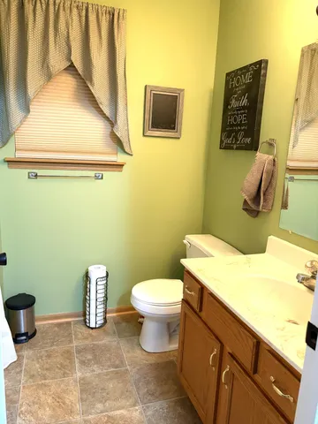 a bathroom with a toilet and a sink