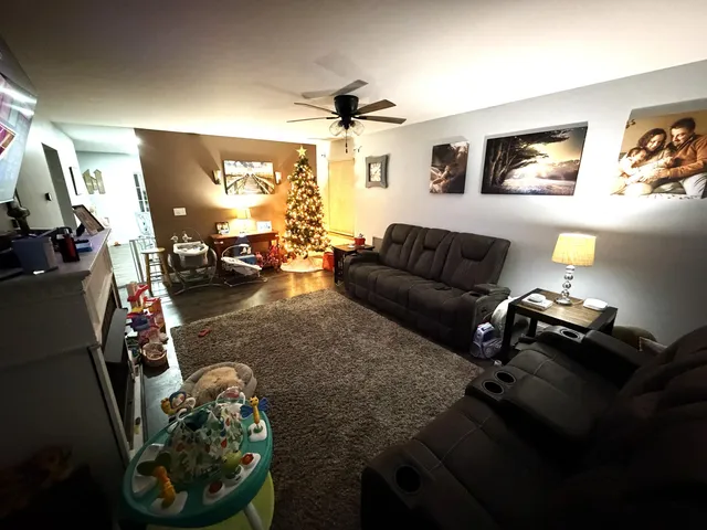 a living room with furniture and a window