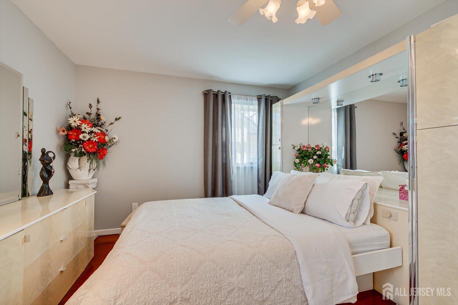71 Crosby Avenue Edison, NJ 08817 - Photo 15 of 40 a bedroom with a bed and a potted plant