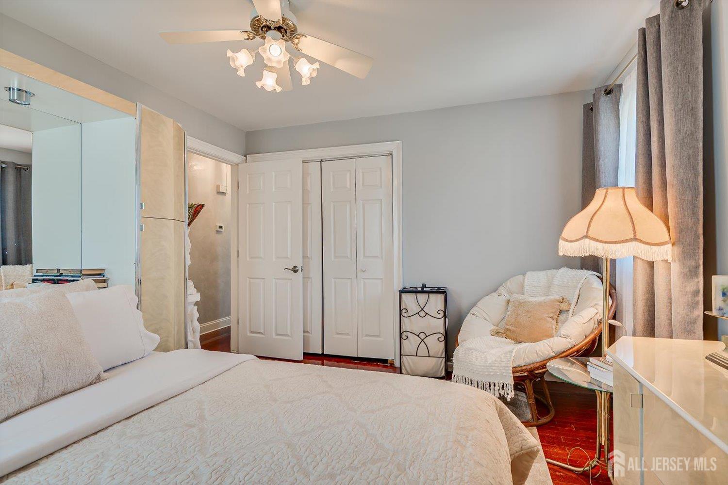 71 Crosby Avenue Edison, NJ 08817 - Photo 16 of 40 a bedroom with a bed and a chandelier