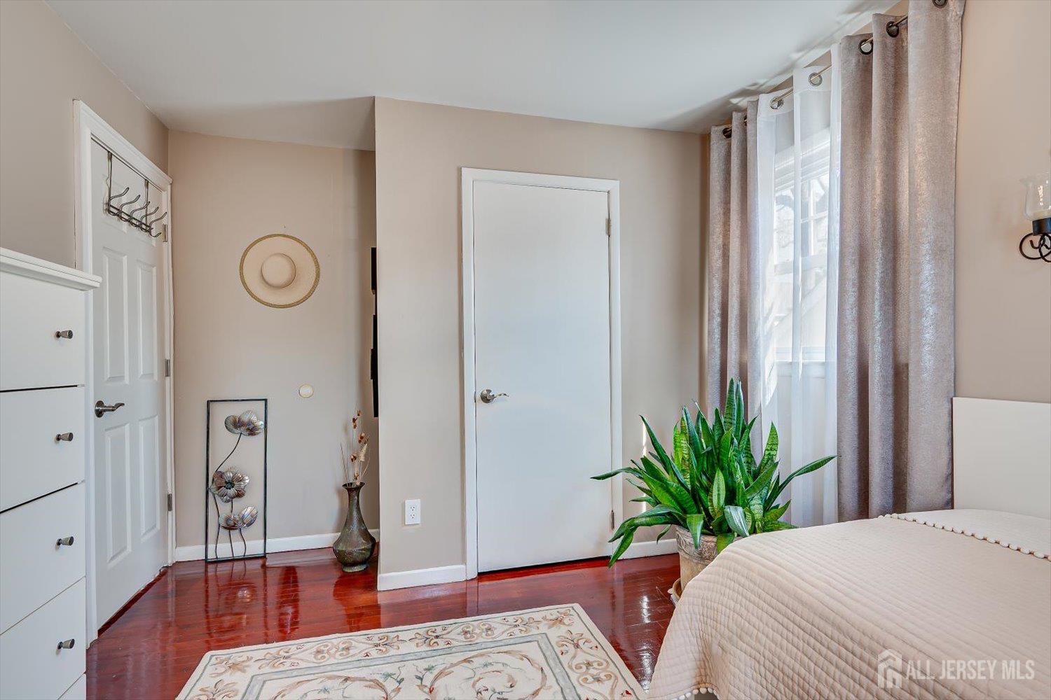 71 Crosby Avenue Edison, NJ 08817 - Photo 18 of 40 a bedroom with a bed and wooden floor