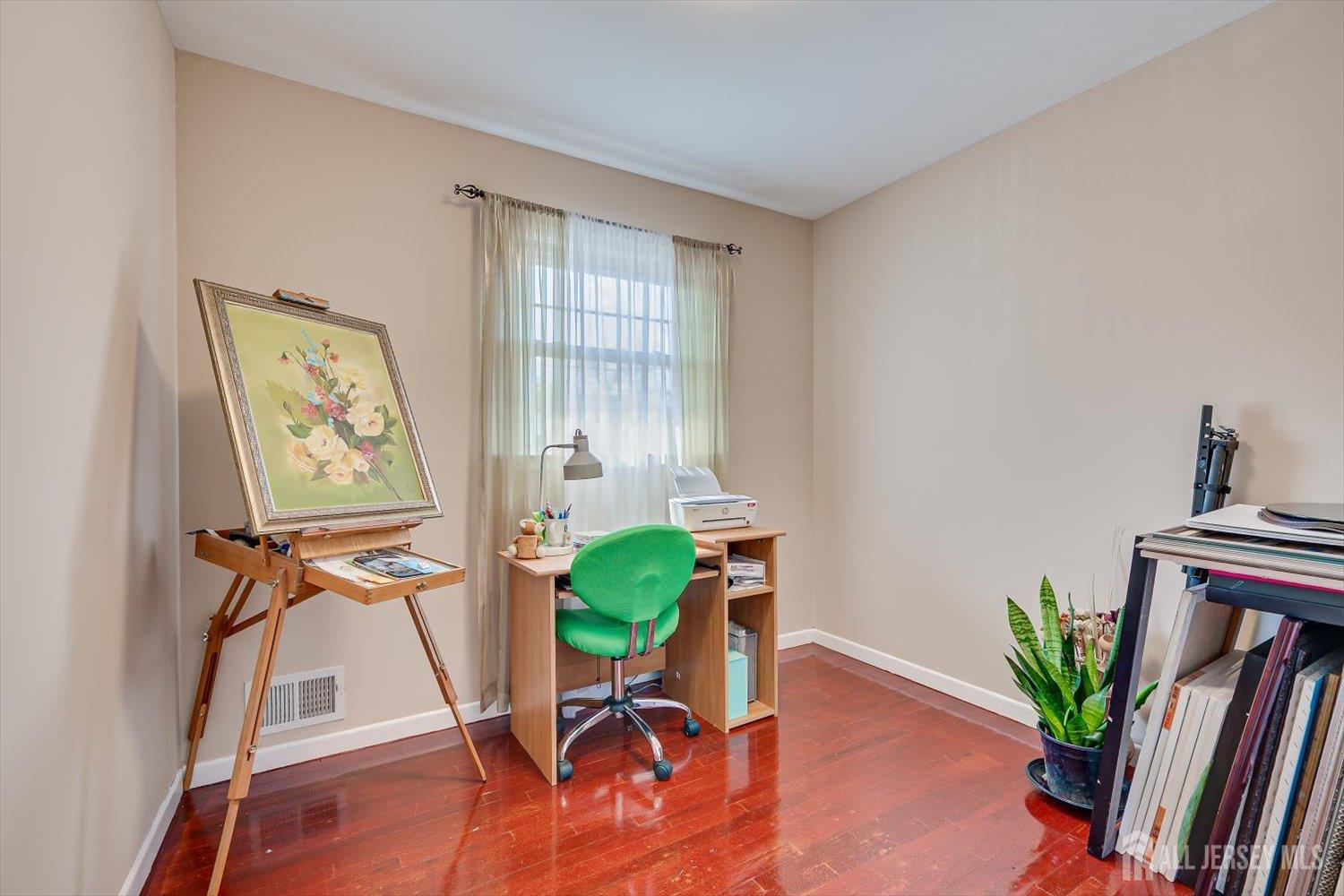 71 Crosby Avenue Edison, NJ 08817 - Photo 20 of 40 a view of a workspace with furniture and a potted plant