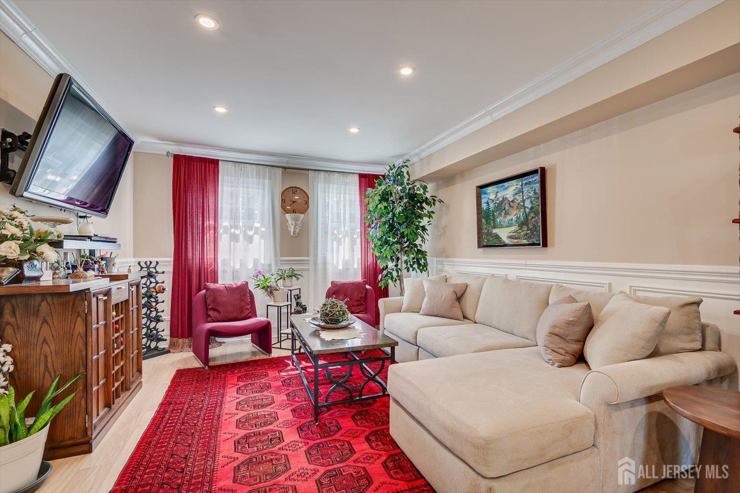 71 Crosby Avenue Edison, NJ 08817 - Photo 22 of 40 a living room with furniture and a flat screen tv
