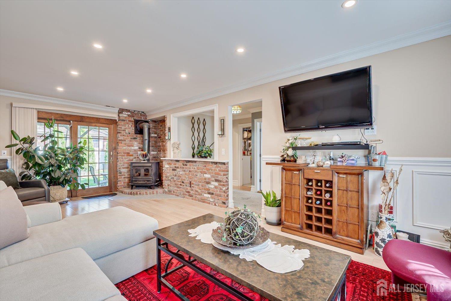 71 Crosby Avenue Edison, NJ 08817 - Photo 23 of 40 a living room with furniture and a flat screen tv