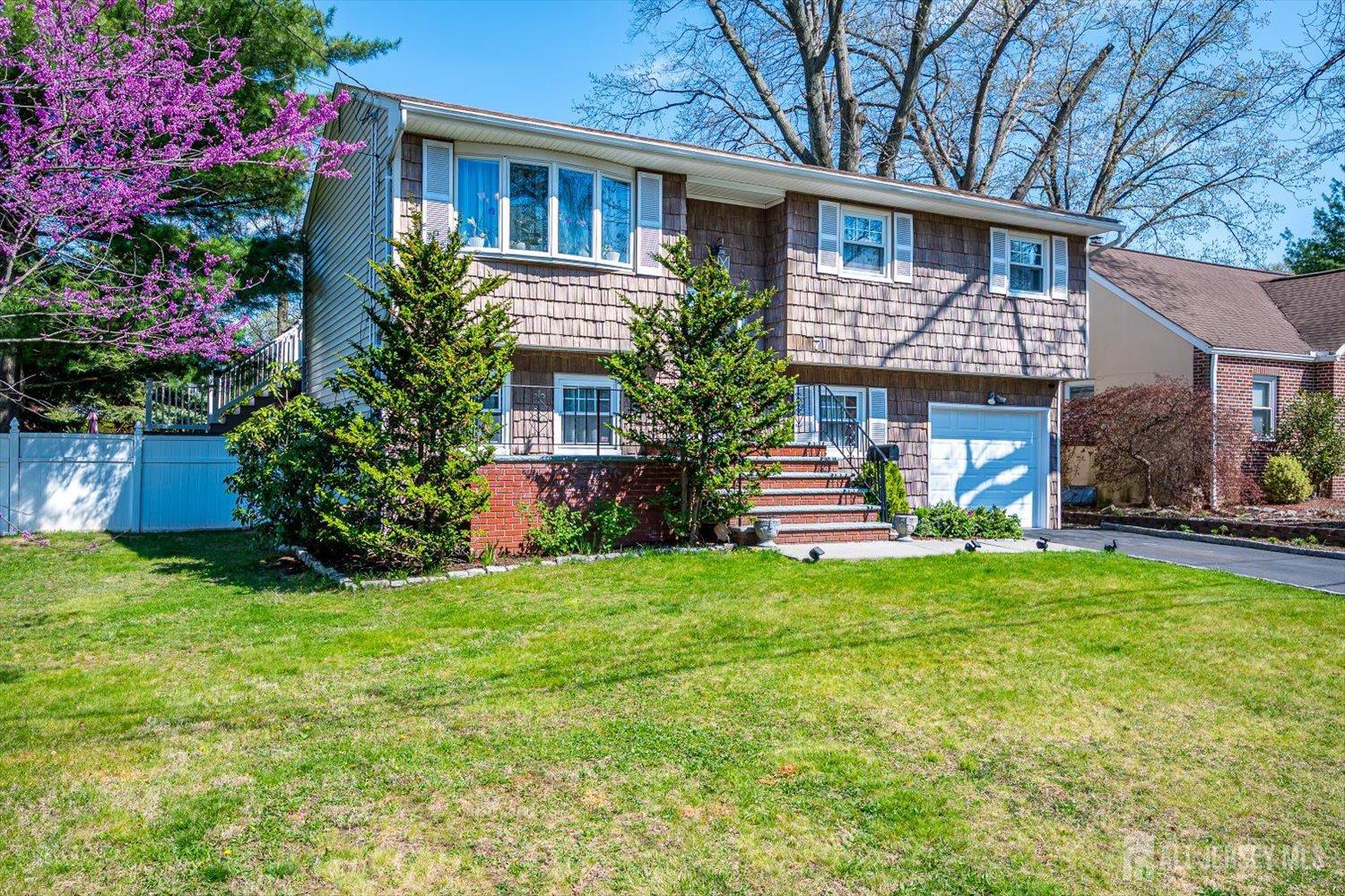 71 Crosby Avenue Edison, NJ 08817 - Photo 3 of 40 a house view with a garden space