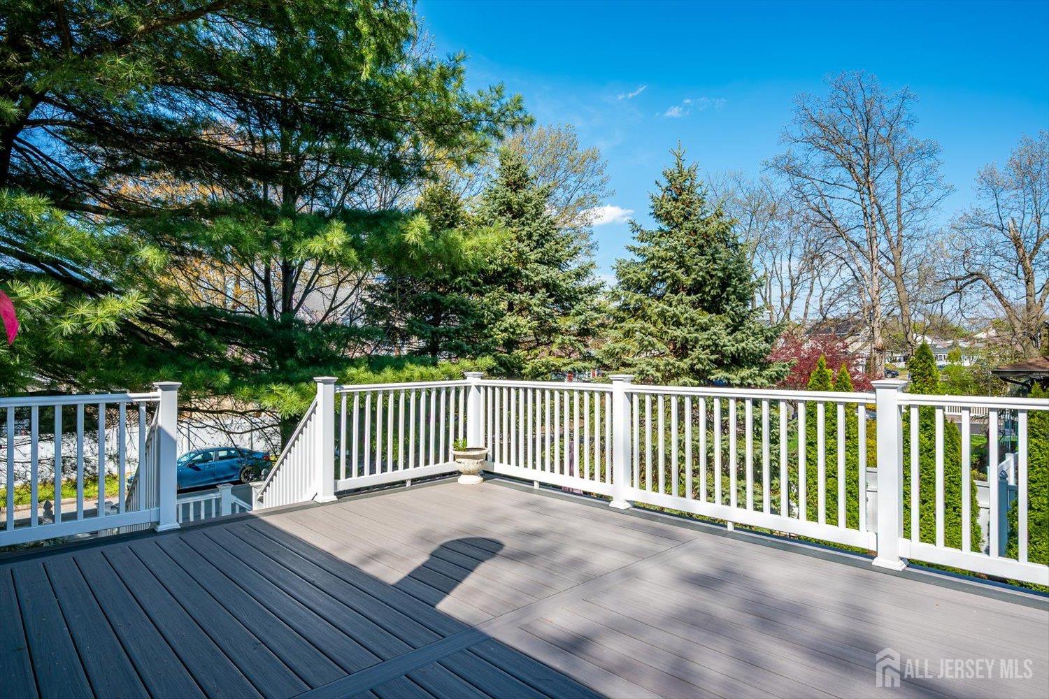 71 Crosby Avenue Edison, NJ 08817 - Photo 32 of 40 a balcony with wooden floor and fence