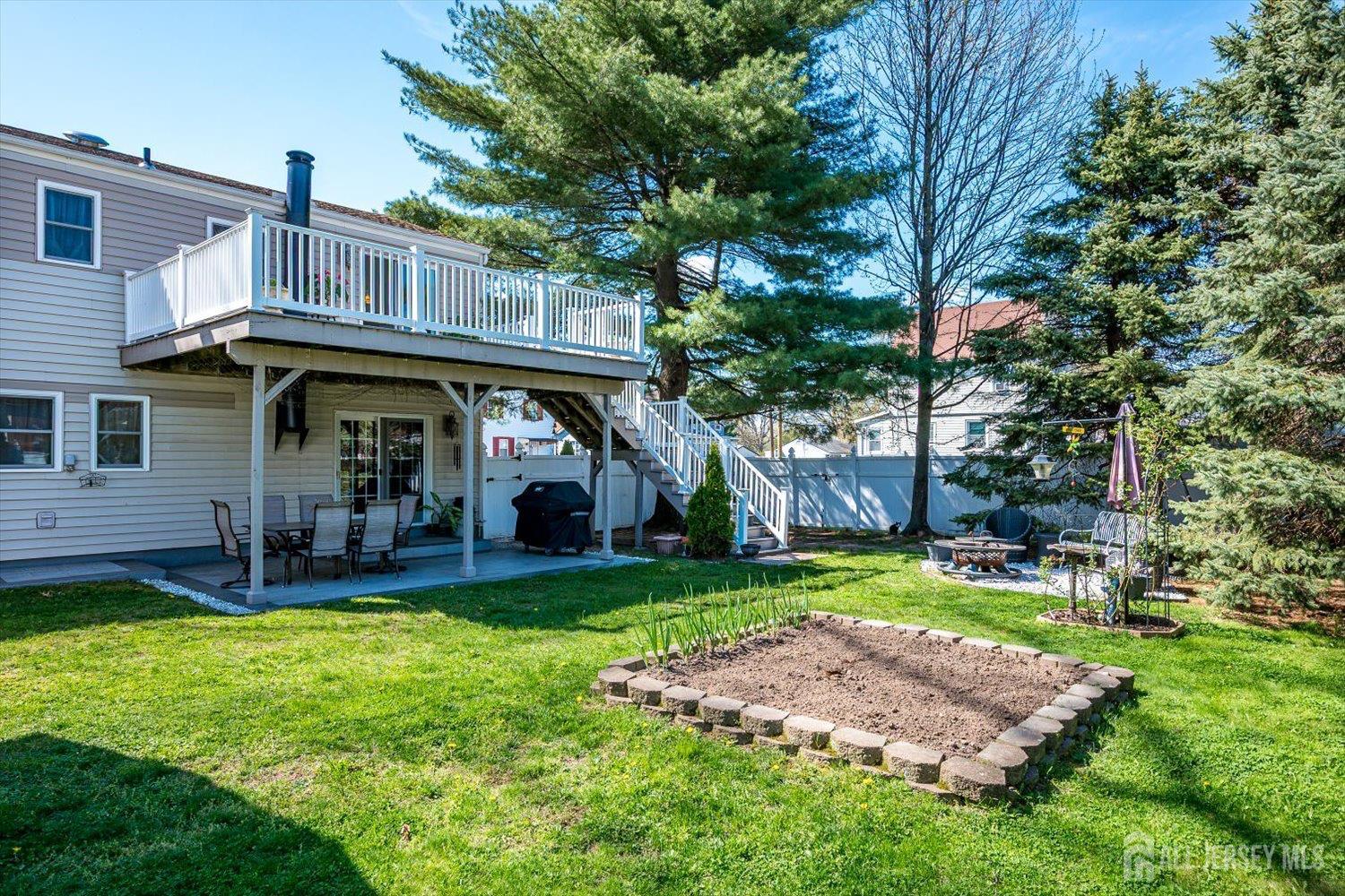 71 Crosby Avenue Edison, NJ 08817 - Photo 33 of 40 a front view of a house with a yard porch and outdoor seating