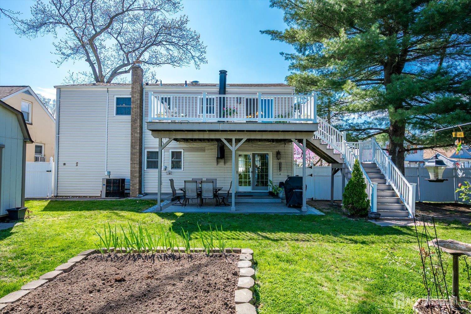 71 Crosby Avenue Edison, NJ 08817 - Photo 34 of 40 a view of a house with a yard and sitting area