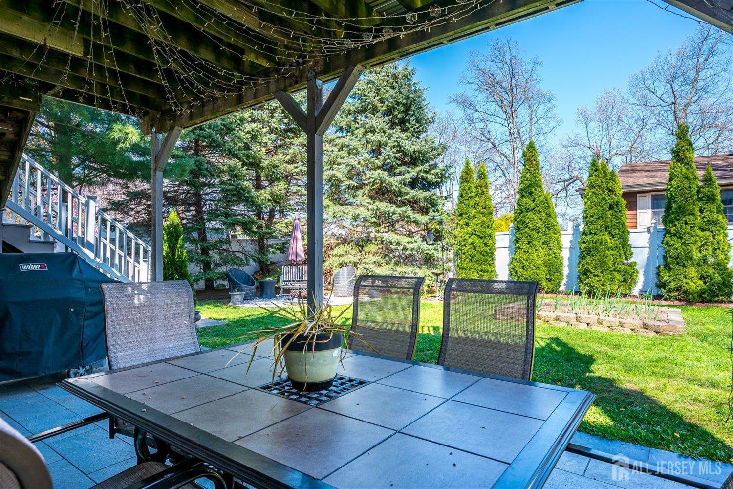 71 Crosby Avenue Edison, NJ 08817 - Photo 35 of 40 a view of a backyard with sitting area