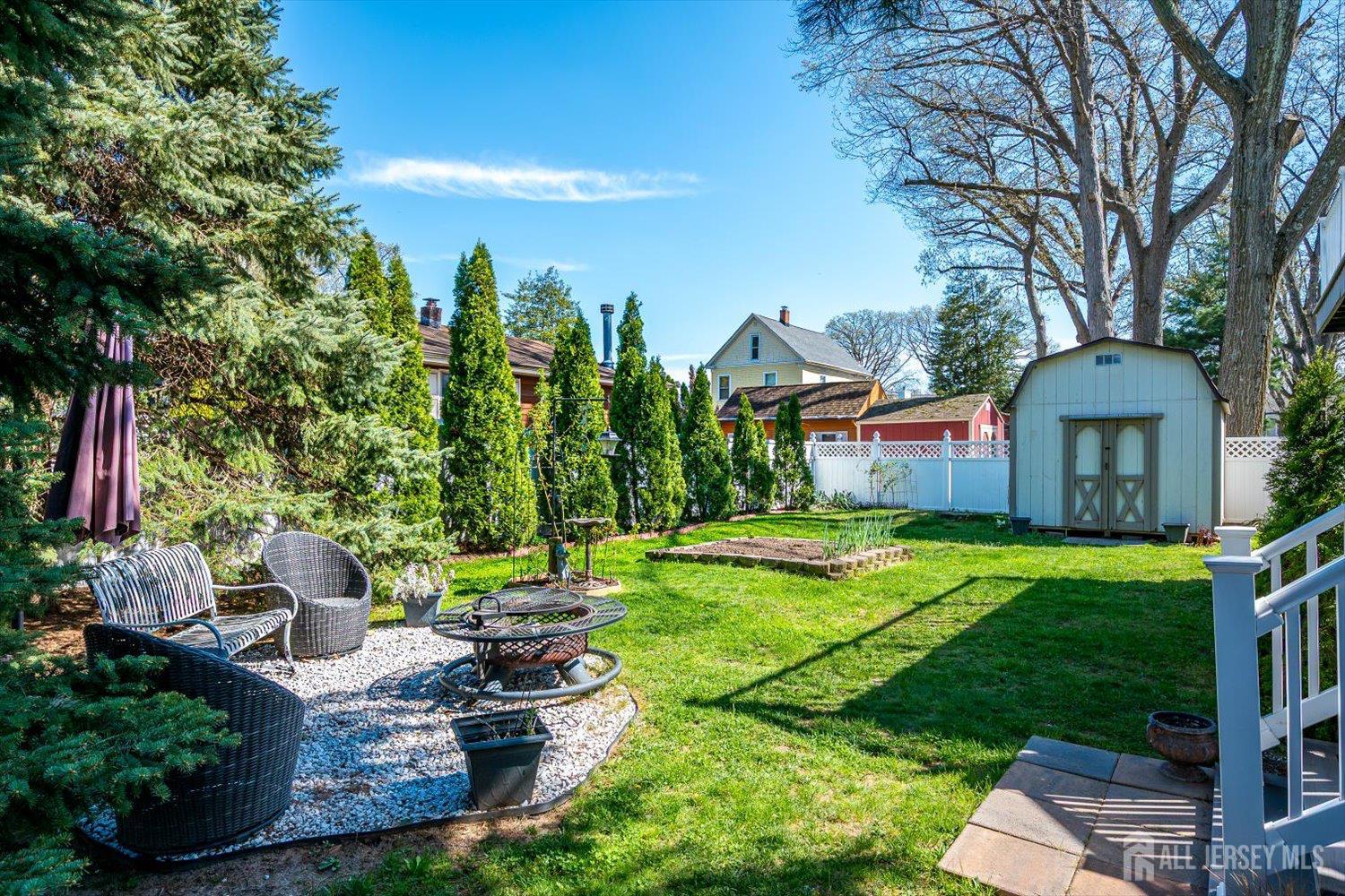 71 Crosby Avenue Edison, NJ 08817 - Photo 36 of 40 a view of a house with backyard sitting area and garden
