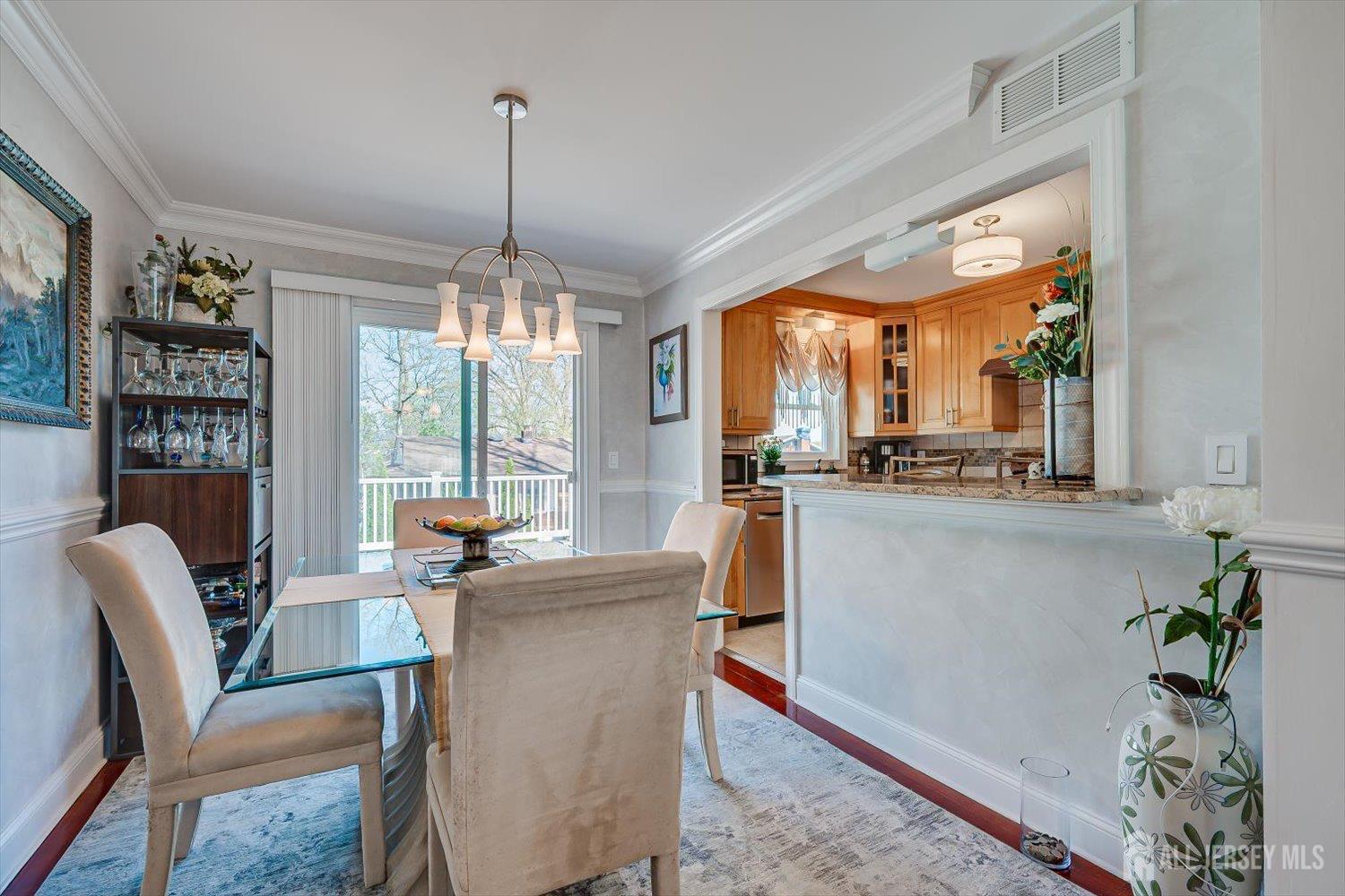 71 Crosby Avenue Edison, NJ 08817 - Photo 8 of 40 a dining room with furniture a chandelier and window