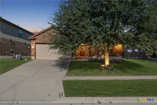 a living room with furniture a ceiling fan and a window