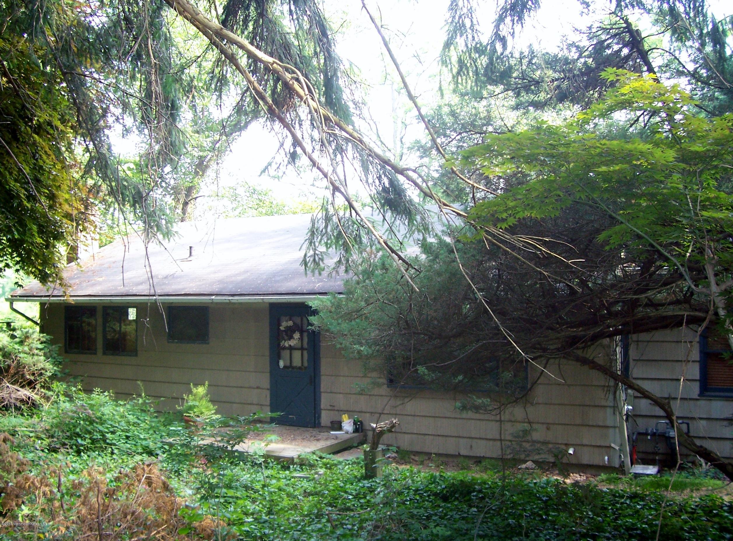 641 Locust Point Road Atlantic Highlands, NJ 07716 - Photo 1 of 2 a front view of a house with a garden