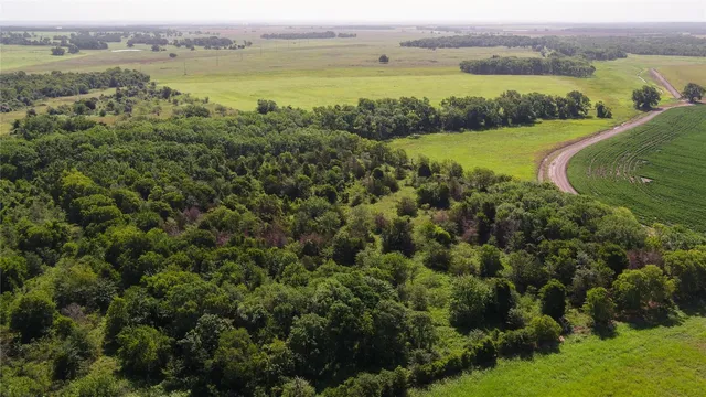 an aerial view of a houses with outdoor space and river