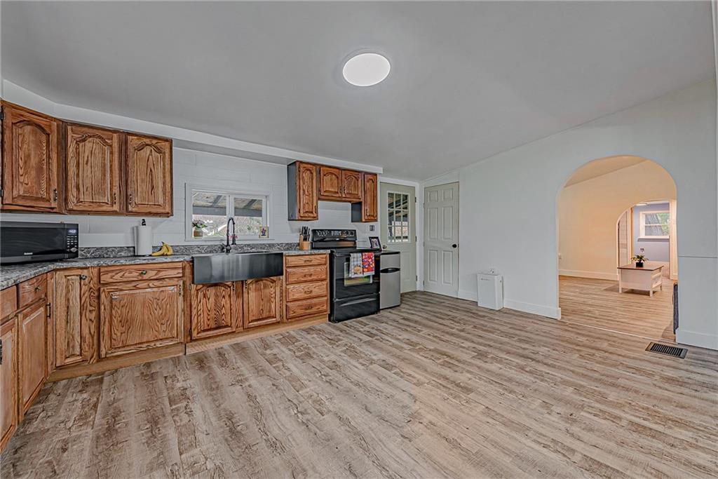 2087 White Cloud Road Leechburg, PA 15656 - Photo 11 of 25 a kitchen with stainless steel appliances granite countertop a stove a sink and a refrigerator
