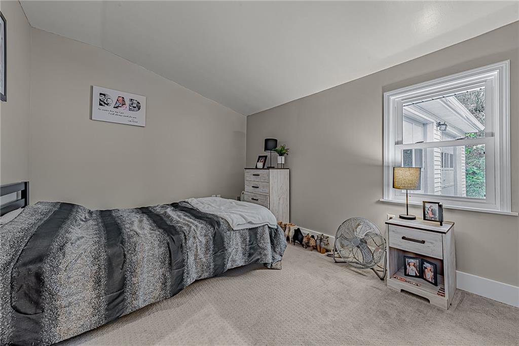 2087 White Cloud Road Leechburg, PA 15656 - Photo 16 of 25 a bed sitting in a bedroom next to a window
